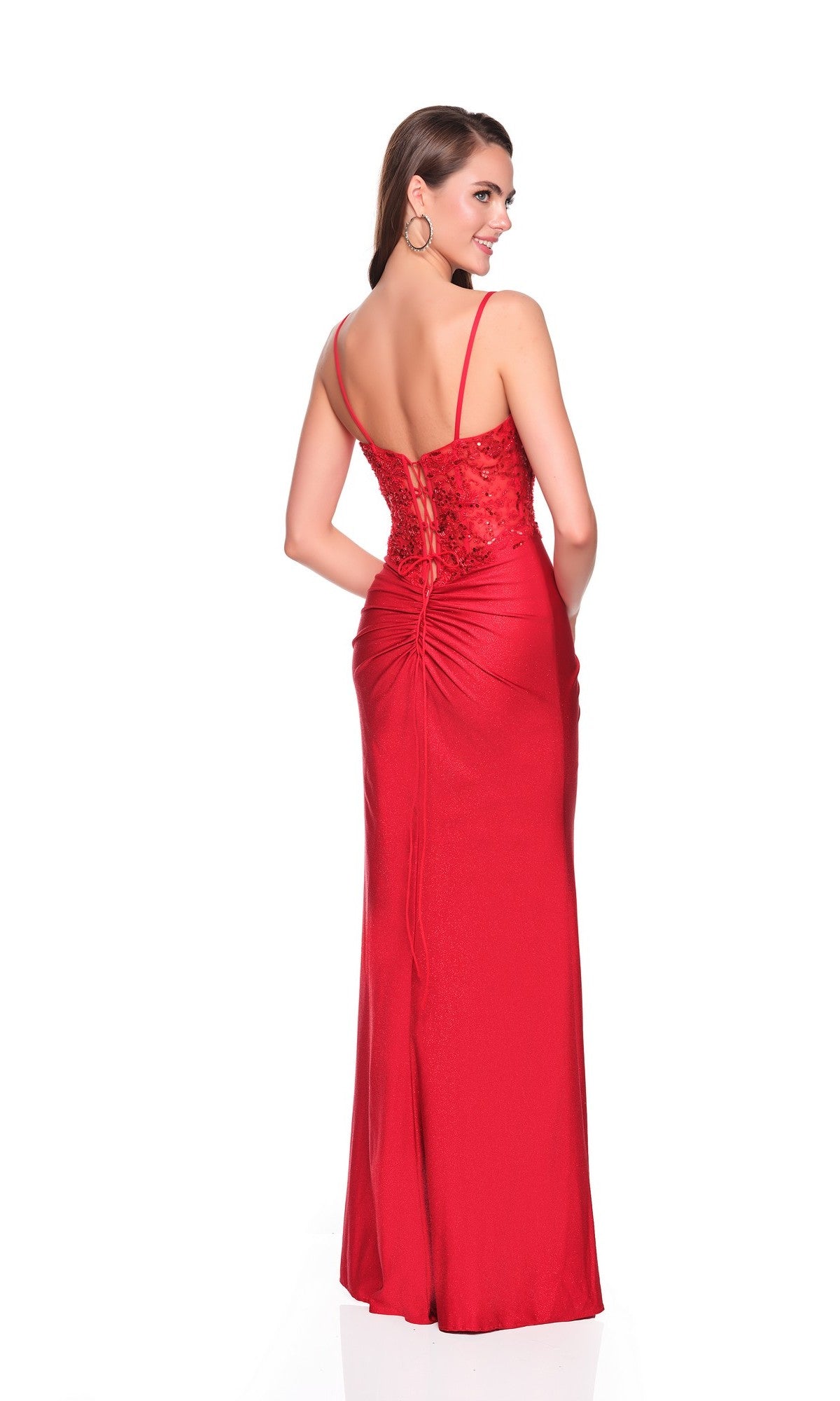 A woman models the Dave and Johnny 12880 long prom dress, featuring a floor-length red design with thin straps and a fitted lace-up back, photographed against a plain white background.